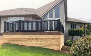 New deck on the main floor of a house in the backyard