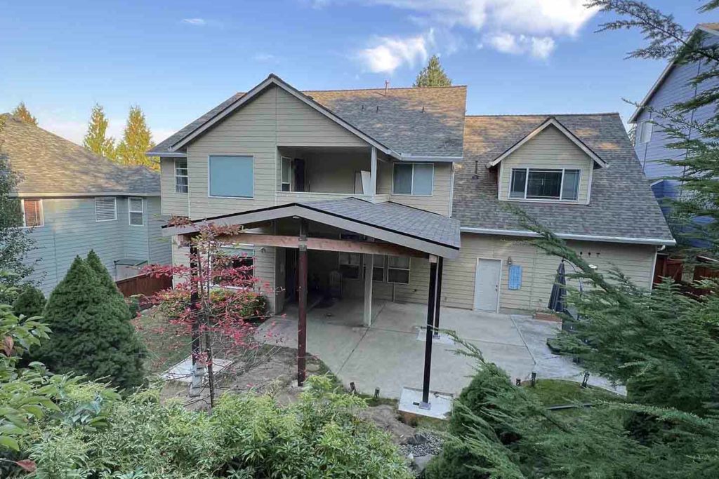 Large roofed patio cover on the backside of a house